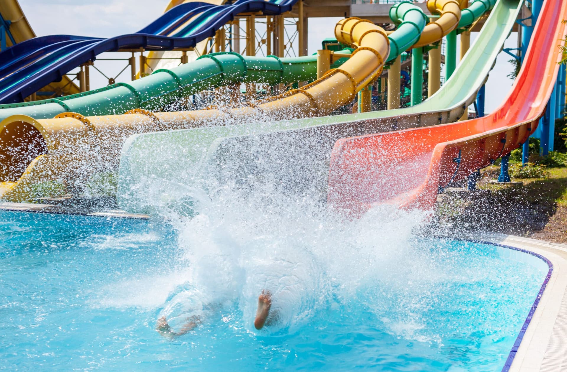 waterpark with waterslides and blue pool